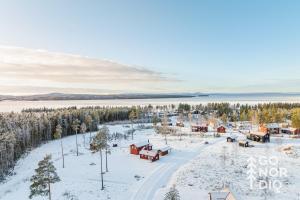 an aerial view of a village in the snow at Red Fox Cabin in Tällberg