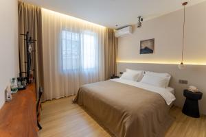 Postel nebo postele na pokoji v ubytování Eden Yard Boutique Hotel and Experiences