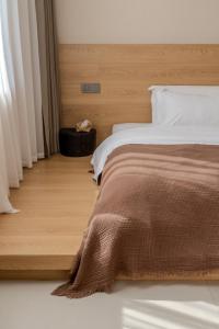Postel nebo postele na pokoji v ubytování Eden Yard Boutique Hotel and Experiences