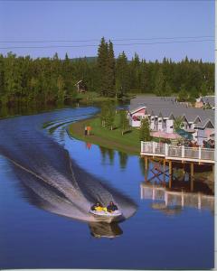 a boat floating on top of a body of water at River's Edge Resort in Fairbanks