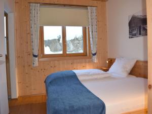 Ένα ή περισσότερα κρεβάτια σε δωμάτιο στο Apartment in Kals near Ski Slopes