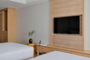 Postel nebo postele na pokoji v ubytování OneJasper Horizon Hotel