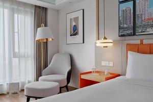 Postel nebo postele na pokoji v ubytování OneJasper Horizon Hotel