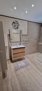a bathroom with a sink and a shower at La villa'mie in Saint-André +17 photos