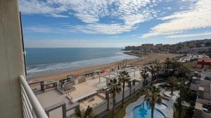 a view of the beach from a balcony of a resort at Torrevieja - La Mata Beach First Line New Apartments 2024r in La Mata