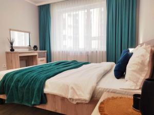 Ένα ή περισσότερα κρεβάτια σε δωμάτιο στο Qonaq Apartments 4YOU 191