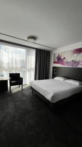 Postel nebo postele na pokoji v ubytování B&B HOTEL Bytom