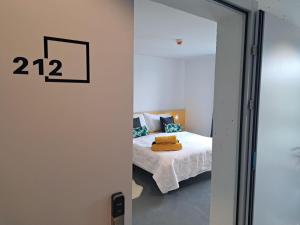 Postel nebo postele na pokoji v ubytování N's Hotel - Self-Check-in Hotel