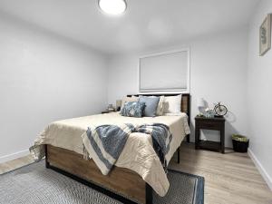 a bedroom with a large bed with a window at Sparn Mountain Hideaway home in Grand Junction
