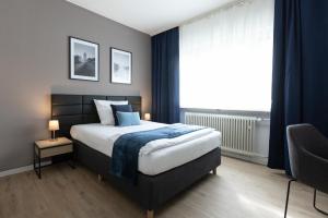Postel nebo postele na pokoji v ubytování Hotel Wegener