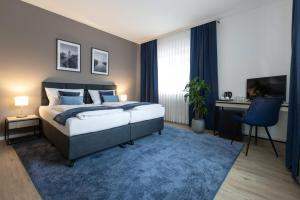 Postel nebo postele na pokoji v ubytování Hotel Wegener