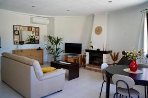 a living room with a couch and a table at Laguna del Flamenco in Torrevieja +24 photos