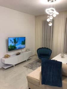 TV a/nebo společenská místnost v ubytování Sweet Escape