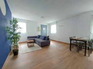 a living room with a couch and a table at Cosy 3 - Audincourt centre in Audincourt