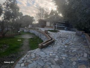 a stone path in front of a house at Ali dede in Kusadası
