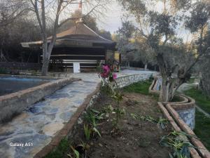 a building with a flower in front of it at Ali dede in Kusadası