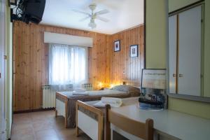 a living room with a couch and a table at Hotel Capriolo in Vidiciatico