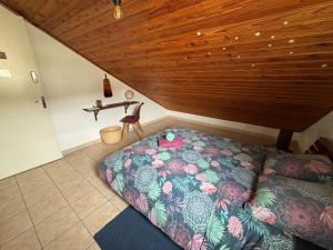 Postel nebo postele na pokoji v ubytování Ti'Kratèr Chambres d'hôtes