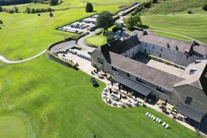 an aerial view of a large building with a lawn at Hôtel & Restaurant Five Nations in Durbuy