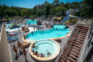 an overhead view of a pool at a water park at Camping Lou Pignada in Messanges