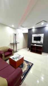 Posezení v ubytování Collection O Muscat Airport Hotel Apartments + 34 fotografií