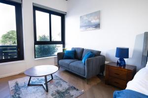 a living room with a couch and a table at Bridgewater Studio Century City in Century City