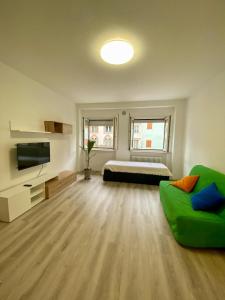 TV a/nebo společenská místnost v ubytování CasaLiva + 20 fotografií