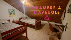 Postel nebo postele na pokoji v ubytování Ti'Kratèr Chambres d'hôtes