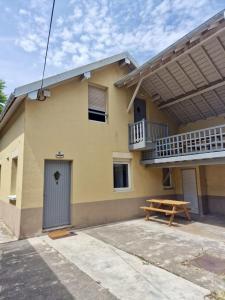 a house with a picnic table in front of it at Cosy 2 - Audincourt centre in Audincourt