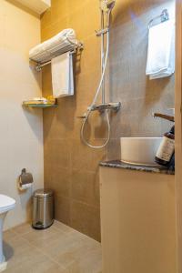 Koupelna v ubytování Mhendo Hotel & Studio Suites