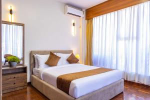 Postel nebo postele na pokoji v ubytování Mhendo Hotel & Studio Suites