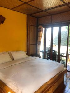 Postel nebo postele na pokoji v ubytování Pai resort pageryaw