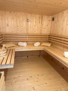 a large wooden sauna with wooden benches in it at Zita Ferienhäuser - Ferienhaus Burgi in Neckargemünd
