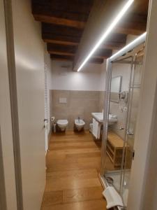 a bathroom with two toilets and a sink at Residenza Della Samaritana in Verona +65 photos
