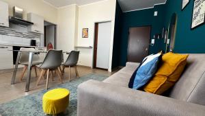 a living room with a couch and a table at Le Dimore del Corso in Catania