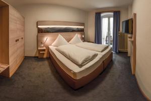 Letto o letti in una camera di Hotel Hirschen