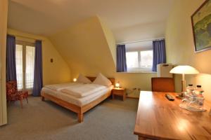 Letto o letti in una camera di Hotel Hirschen