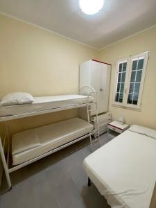 A bed or beds in a room at Residence Ammiraglia Baia Verde