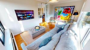 an overhead view of a living room with a large couch at Croyde Broadlands 5 Bedrooms in Croyde