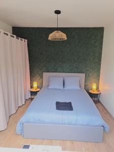 Ένα ή περισσότερα κρεβάτια σε δωμάτιο στο La Maison Pessac