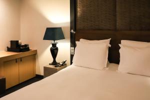 Postelja oz. postelje v sobi nastanitve The Dominican, Brussels, a Member of Design Hotels
