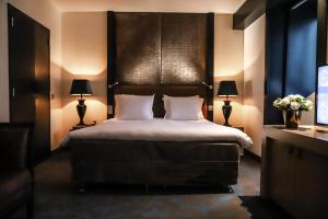 Postelja oz. postelje v sobi nastanitve The Dominican, Brussels, a Member of Design Hotels