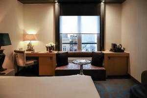 Postelja oz. postelje v sobi nastanitve The Dominican, Brussels, a Member of Design Hotels