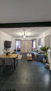 a living room with a couch and a table at Piso Bosique in San Pedro del Pinatar