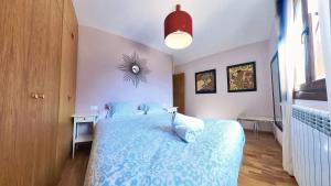 Postel nebo postele na pokoji v ubytování La Casa de Ra - tucasaenlospirineos