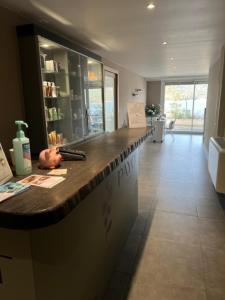a lobby with a counter in a room at Résidence Cas’Antica in Propriano +28 photos