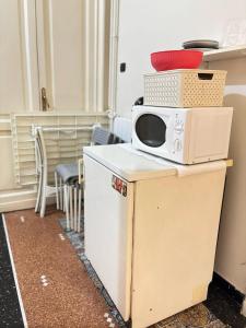 Kuchyň nebo kuchyňský kout v ubytování Suite Tolemaide