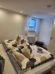 a bedroom with two beds with pillows on them at Ferienwohnung Panoramablick in Wertach