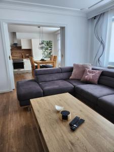 a living room with a couch and a coffee table at Ferienwohnung Panoramablick in Wertach