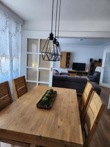 a dining room table with chairs and a couch at Ferienwohnung Panoramablick in Wertach +14 photos